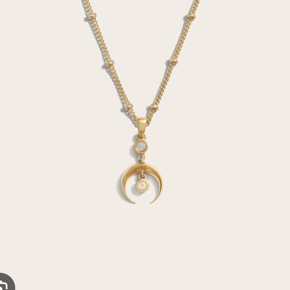 New awe inspired Gold Crescent Spike Opal amulet